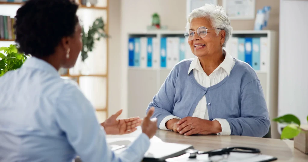 A Licensed Medicare agent talking to a senior about Monthly Premiums And Out Of Pocket Costs