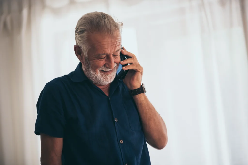 A old man Schedule A Medicare Telehealth Visit on phone call.